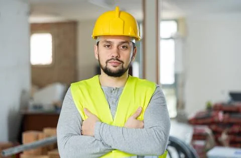 Focused foreman posing on indoor construction site Stock Photos