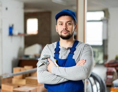 Focused foreman posing on indoor construction site Stock Photos