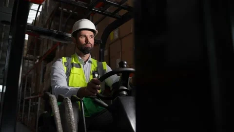 Focused forklift driver during work in storage Stock Footage 161950936