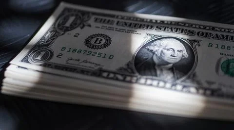 Focused fragment of an stack of one dollar bill for abstract background Foto stock