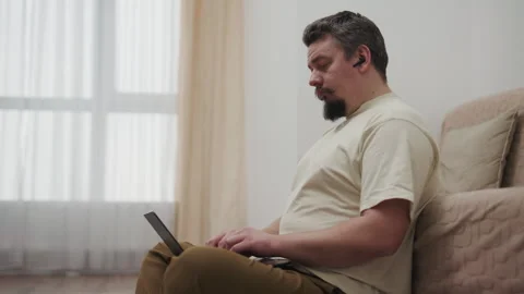 Focused freelancer working remotely from home on laptop computer Stock Footage 340929521