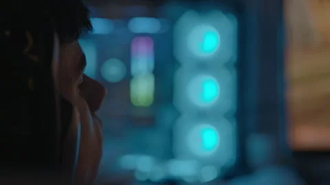 Focused gamer playing on computer with rgb lights Stock Footage 345924211