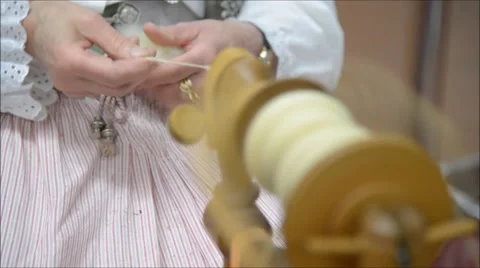 Focused hands with blurred spinning wheel 库存影片 47666906