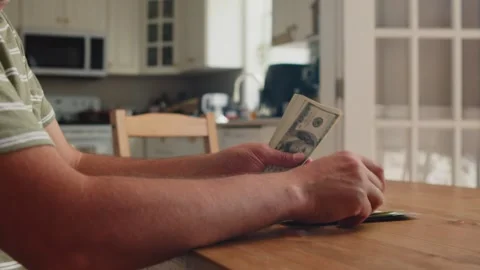 Focused Hands Count Money On A Table At Home In Midday Light Stock Footage 312526292