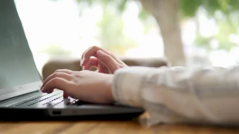 Focused Hands Typing on Laptop in a Bright Environment Stock Footage 316666272