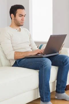 Focused handsome man using his tablet computer 스톡 사진