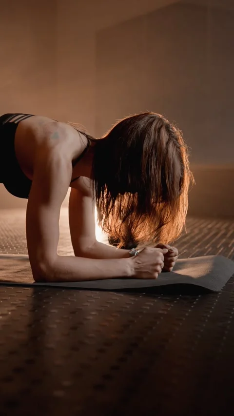 Focused on her goal, the athlete does heavy exercises built on strengthening the Stock Footage 268264044