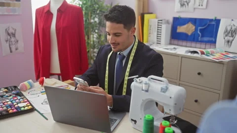 A focused hispanic man tailoring in a colorful atelier, with a sewing machi.. Stock Footage 270317265