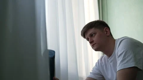 Focused housekeeper using professional steam cleaner, sanitizing white curtains Stock Footage 304883881
