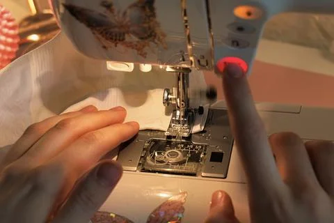 Focused Image of Skilled Hands Running a Sewing Machine Stock Photos