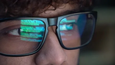 Focused indian developer coder wears glasses working on computer. Stock Footage 200258789