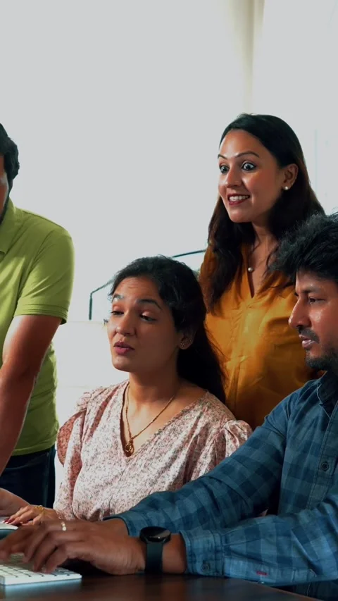Focused Indian startup team working together on a crucial project in office Stock Footage 342508075