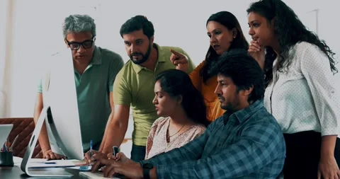 Focused Indian startup team working together on a crucial project in office Stock Footage 342510978