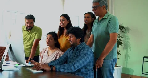 Focused Indian startup team working together on a crucial project in office Stock Footage 342511009