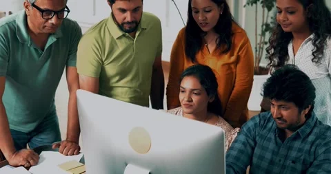 Focused Indian startup team working together on a crucial project in office Stock-Footage 342511108