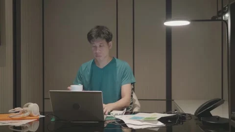 Focused Individual Working on a Laptop in a Modern Office Stock Footage 318917196