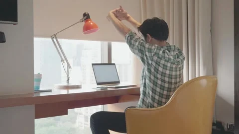 Focused Individual Working Remotely in a Modern Workspace Stock Footage 319415112