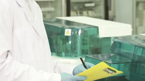 Focused lab technician analyzing results with precision Stock Footage 311981673