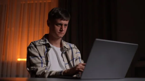 Focused male freelancer worker typing on modern laptop while surfing internet Stock Footage 264160186