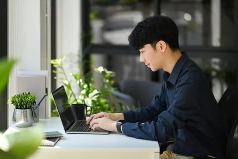 Focused male programmer or coder working for development website design in Stock Photos
