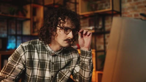 Focused male programmer working on computer in retro office, software creation Stock Footage 315456191