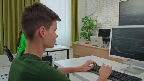 Focused Male Student Programming on Computer in Classroom Stock Footage 281072051