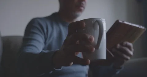Focused Man Drinks Coffee While Using Tablet Stock Footage 94396508