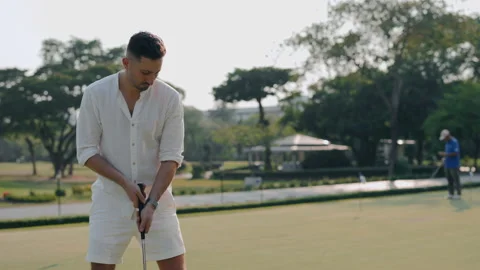 Focused man golfer with driver preparing to hit on course Stock Footage 304221028