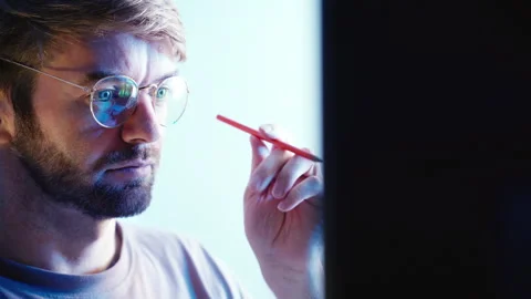 Focused man holding pencil thinking at work Stock Footage 318318268