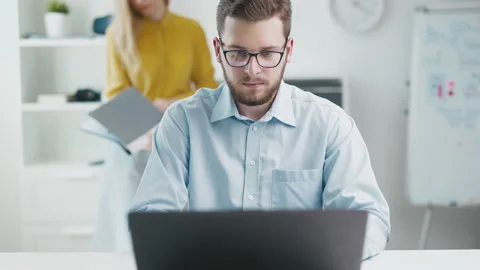 Focused man in office Stock Footage 203659200