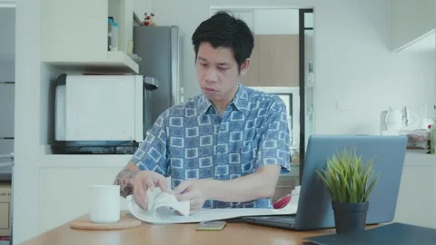 Focused Man Reviewing Documents at Home Office Stock Footage 314594207