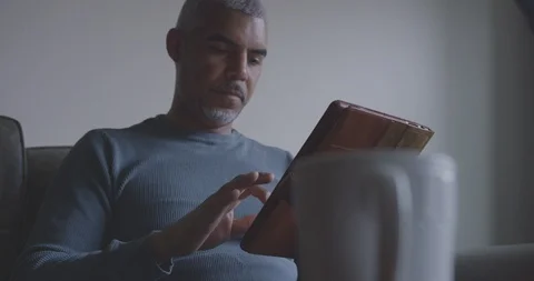 Focused Man Uses Digital Tablet in Morning Stock Footage 94396418