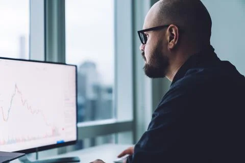 Focused man using computer in office Stock Photos