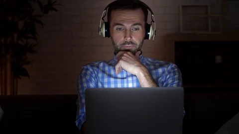 Focused man using laptop at night Stock-Footage 101323259