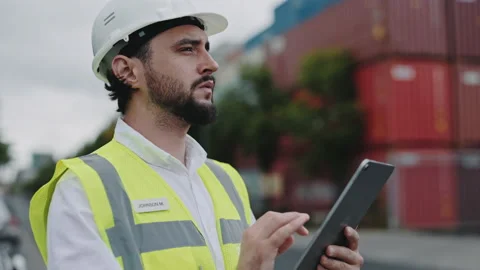 Focused man using tablet for work at warehouse harbor Stock-Footage 167164783