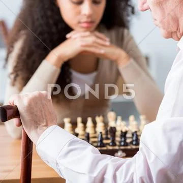 Focused people playing chess Stock Photos