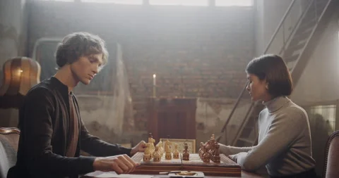Focused Players in a Dramatic Chess Match in a Vintage Room Setting Stock Footage 299547490