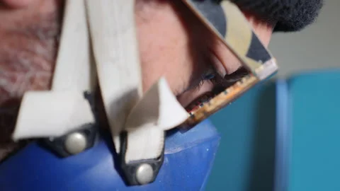 Focused Precision: A Carpenter's Determination While Cutting Wood on the Bandsaw Stock-Footage 135245911