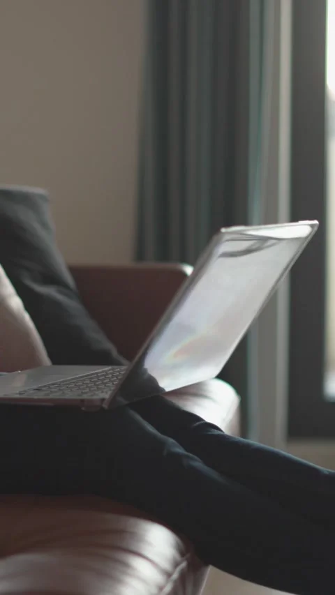 A focused professional is diligently working remotely while sitting on a laptop Stock Footage 293147734