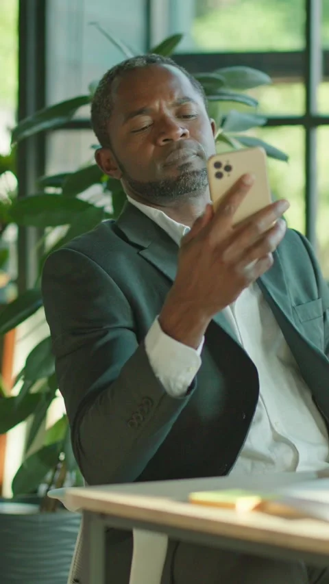 A Focused Professional Engaged in Accomplished Work within a Modern Office Stock Footage 314361681