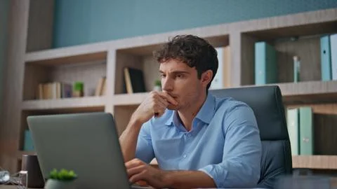 Focused professional thinking problem in office closeup. Young businessman read Foto stock