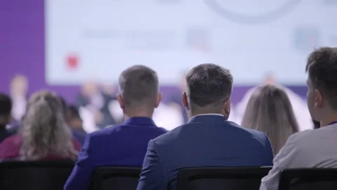 Focused professionals in modern conference environment engaging deeply, Business Stock Footage 328905162