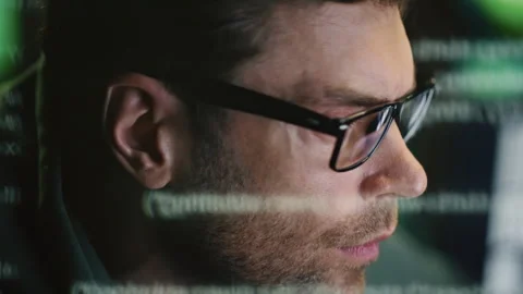 Focused programer face watching computer in data hologram closeup. Man coding Stock Footage 260260362