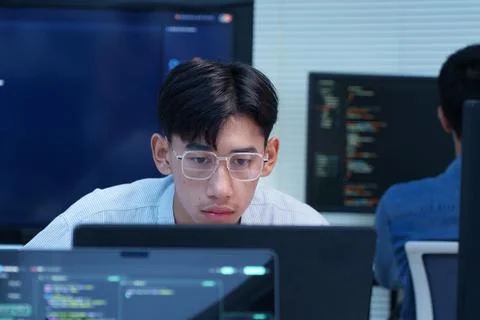 Focused Programmer Coding on a Computer Stock Photos