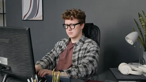 Focused Programmer with Glasses Coding on Computer in Office 스톡 동영상 336750233