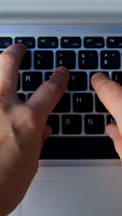 Focused programmer typing during late hours. Bright keyboard illuminates skilled Video stock 344738473