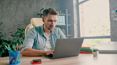 Focused programmer typing keyboard finish million dollar start-up project Stock Footage 162025698