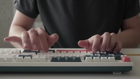 Focused programmer typing on mechanical keyboard Stock-Footage 336571678
