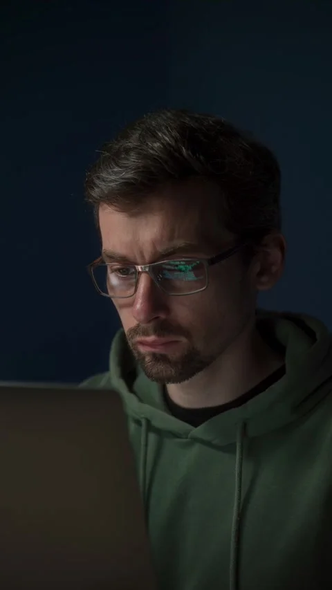 Focused programmer working on computer code Stock Footage 303998426