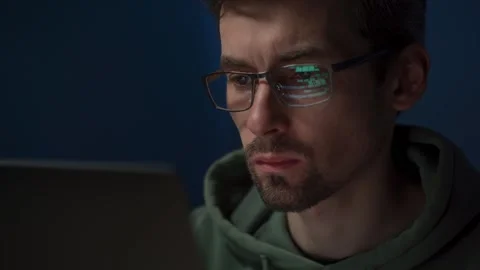 Focused programmer working on computer code Stock Footage 308016160
